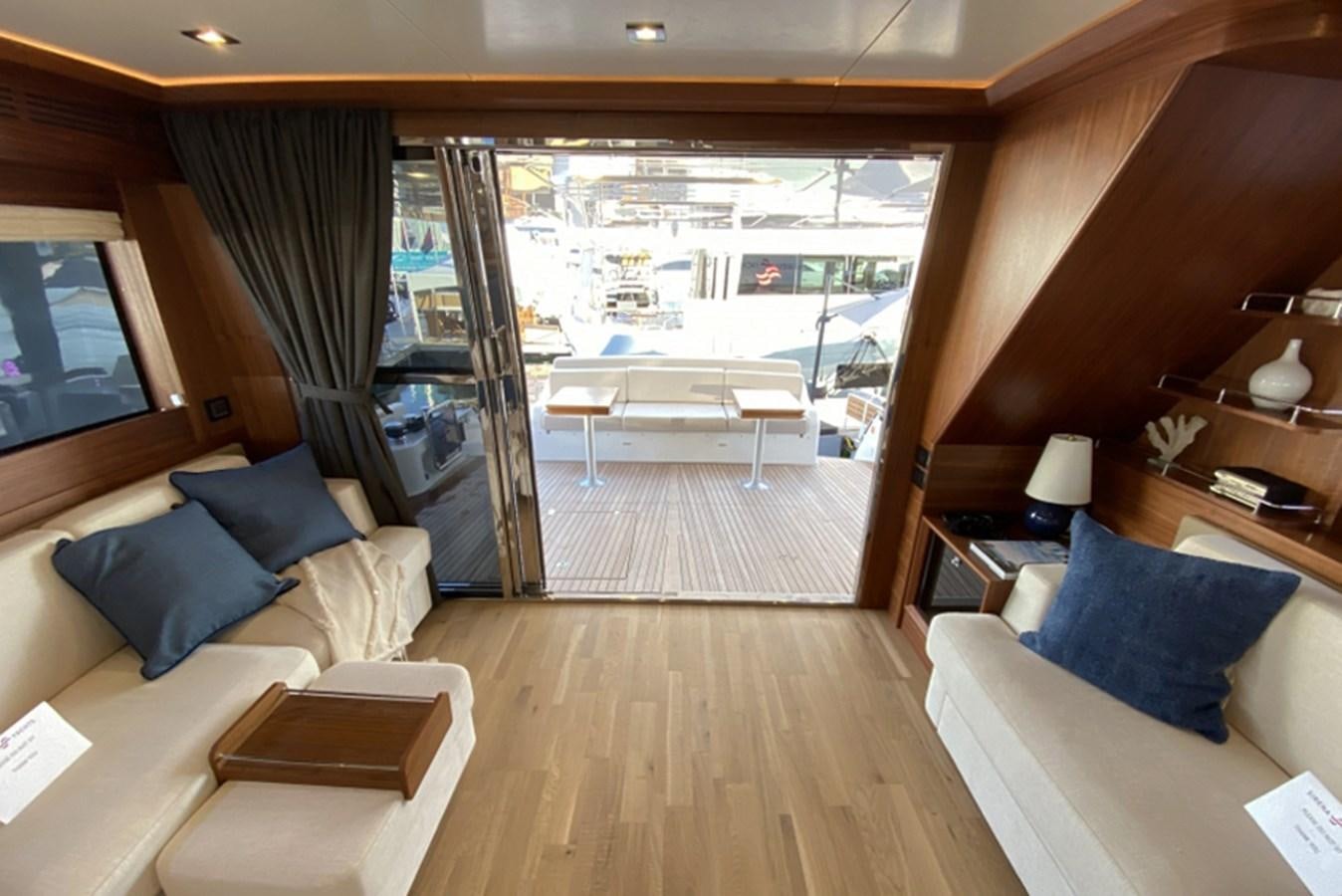 a room with a view of a city and a large patio aboard SIRENA 64 FLYBRIDGE Yacht for Sale