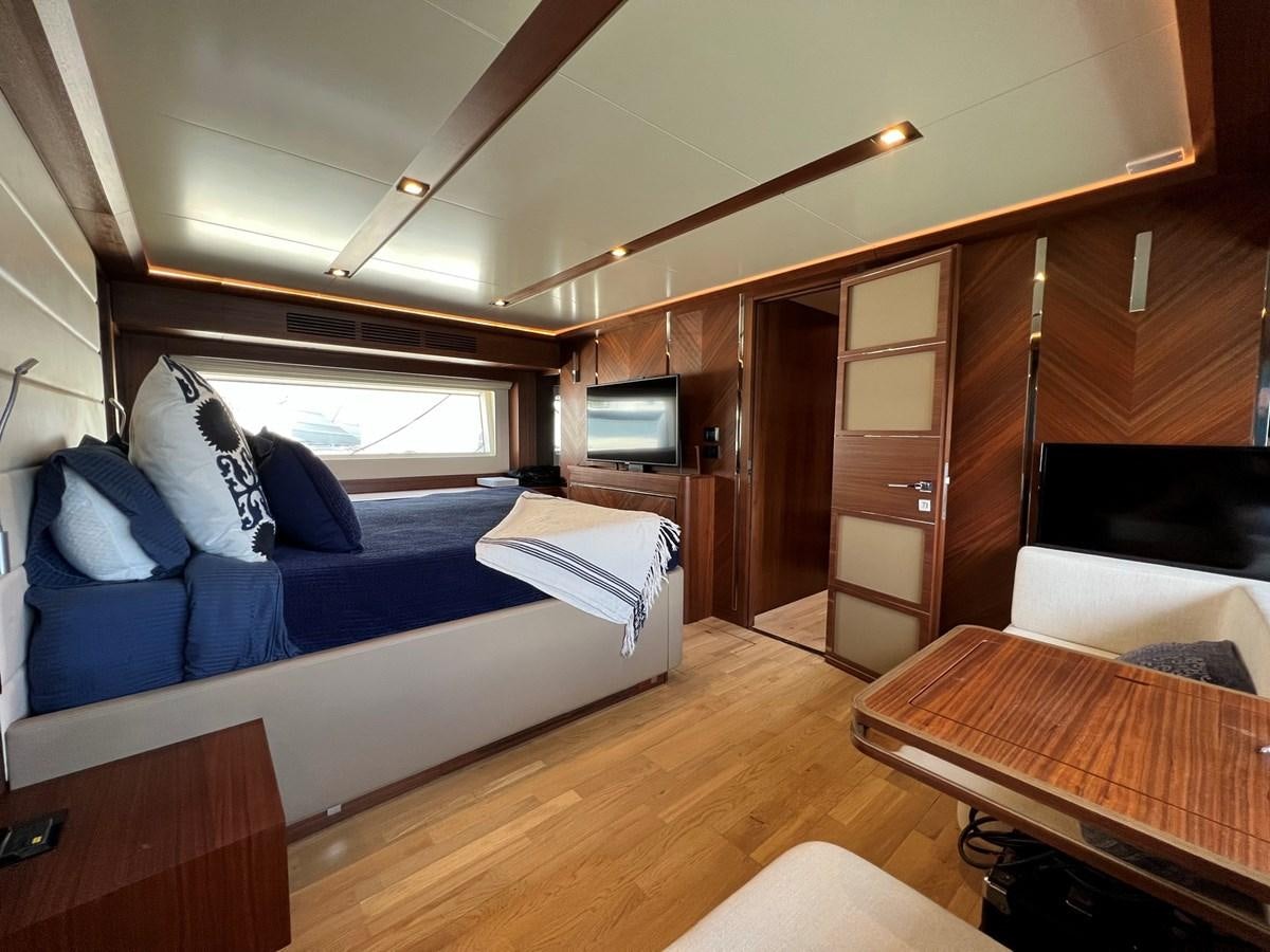 a room with a bed and a tv aboard SIRENA 64 FLYBRIDGE Yacht for Sale