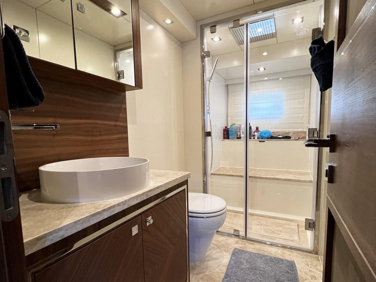 a bathroom with a sink and toilet aboard SIRENA 64 FLYBRIDGE Yacht for Sale