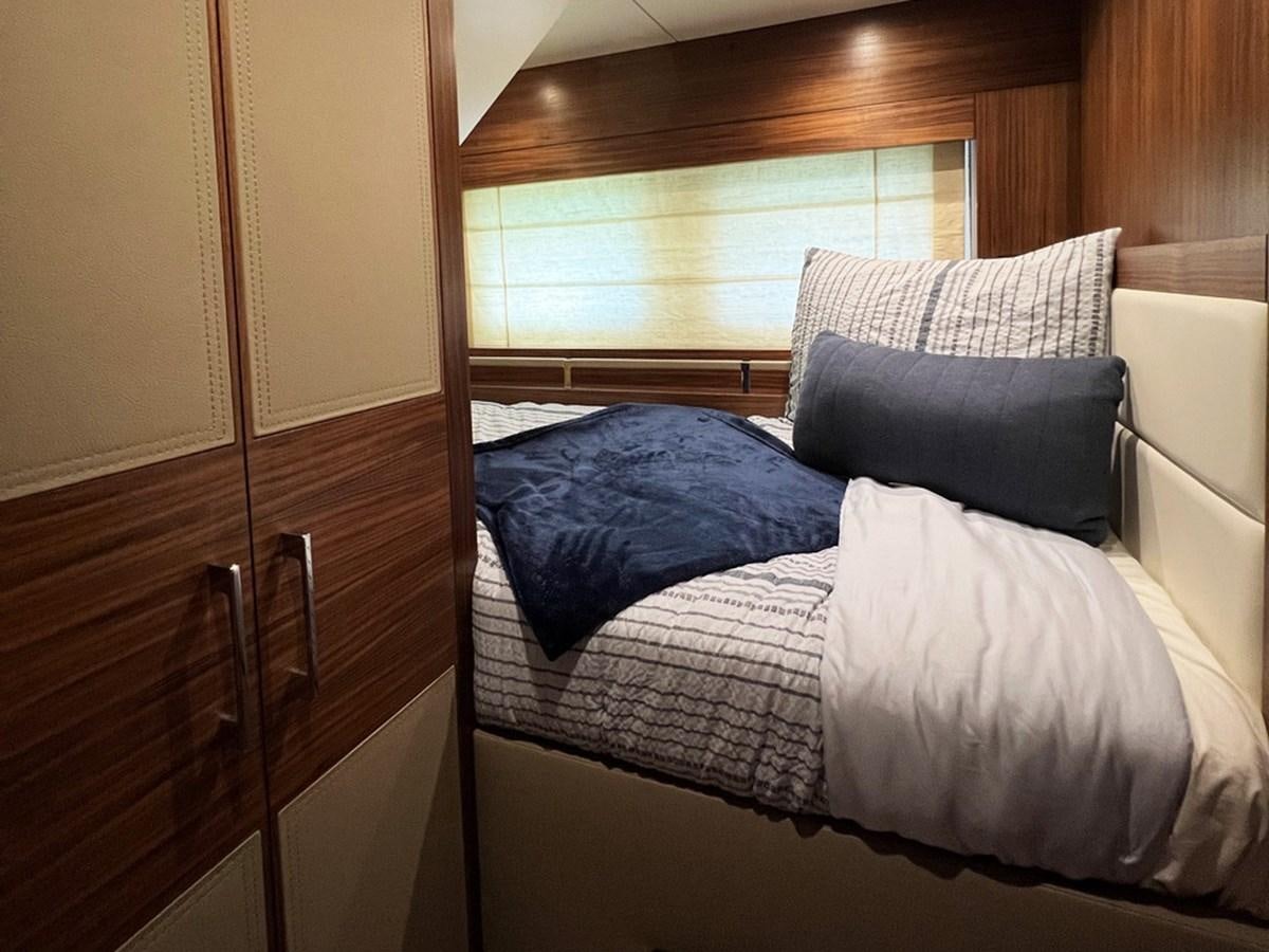 a bed with pillows aboard SIRENA 64 FLYBRIDGE Yacht for Sale