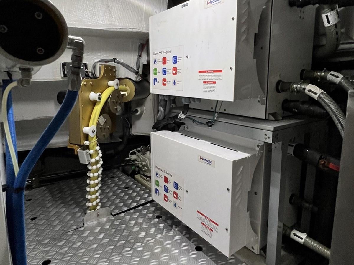 a machine with a yellow measuring tape aboard SIRENA 64 FLYBRIDGE Yacht for Sale