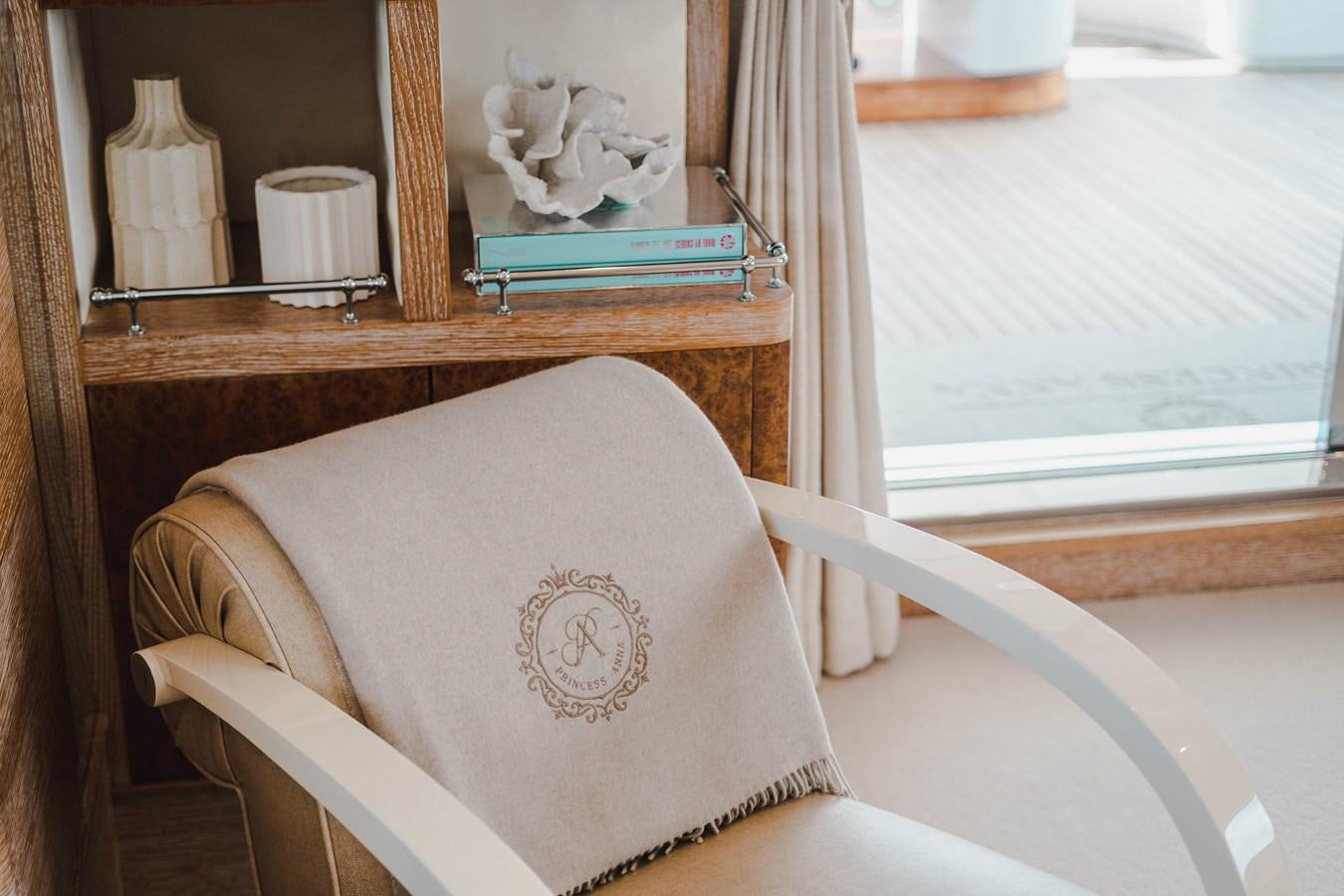 a chair in front of a window aboard ARTEMISEA Yacht for Charter