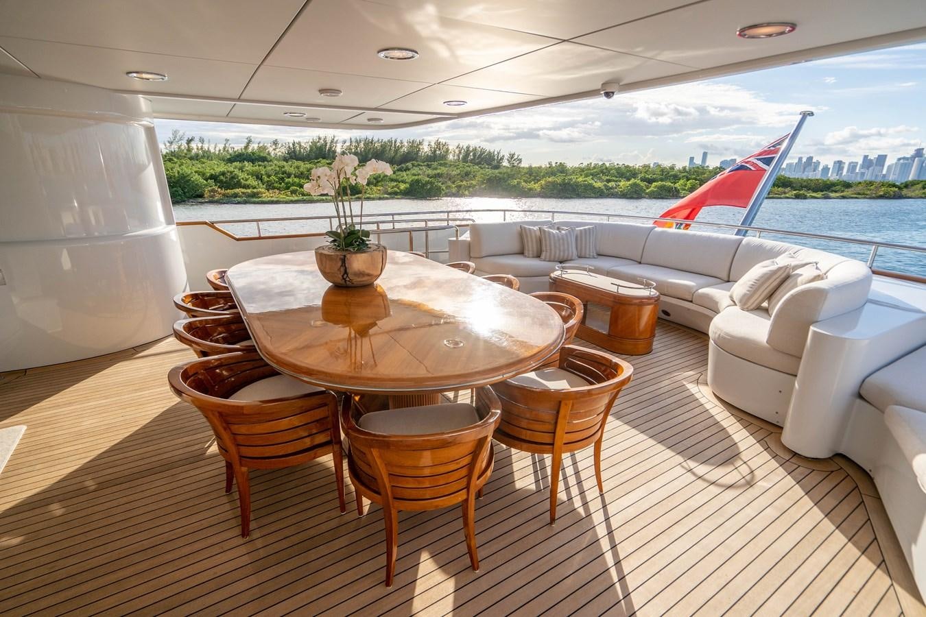 a room with a table chairs and a large window aboard ARTEMISEA Yacht for Charter