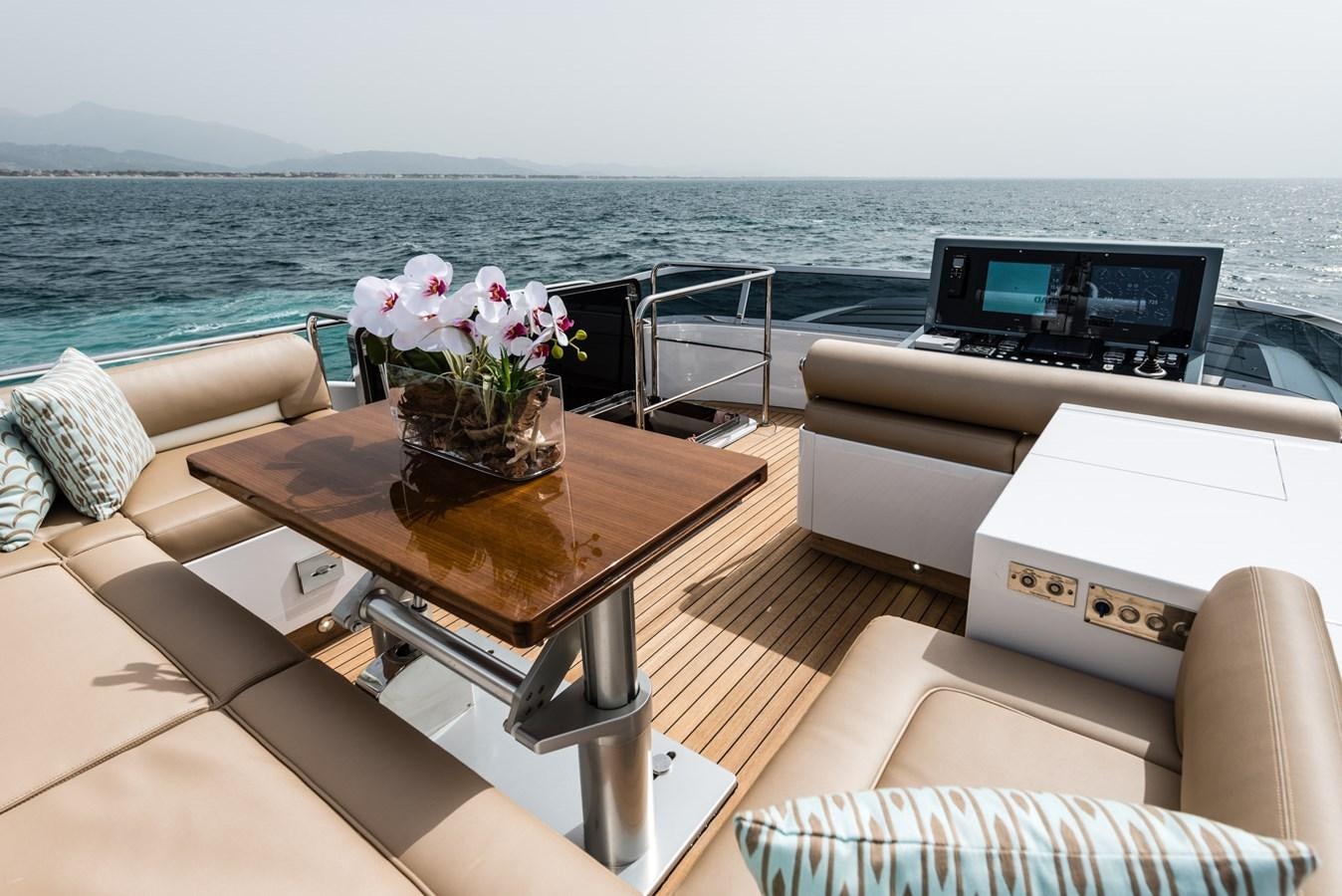 a table with flowers on it aboard MINE SET Yacht for Sale