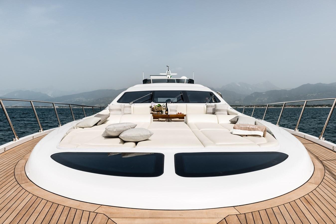 a white yacht on a dock aboard MINE SET Yacht for Sale