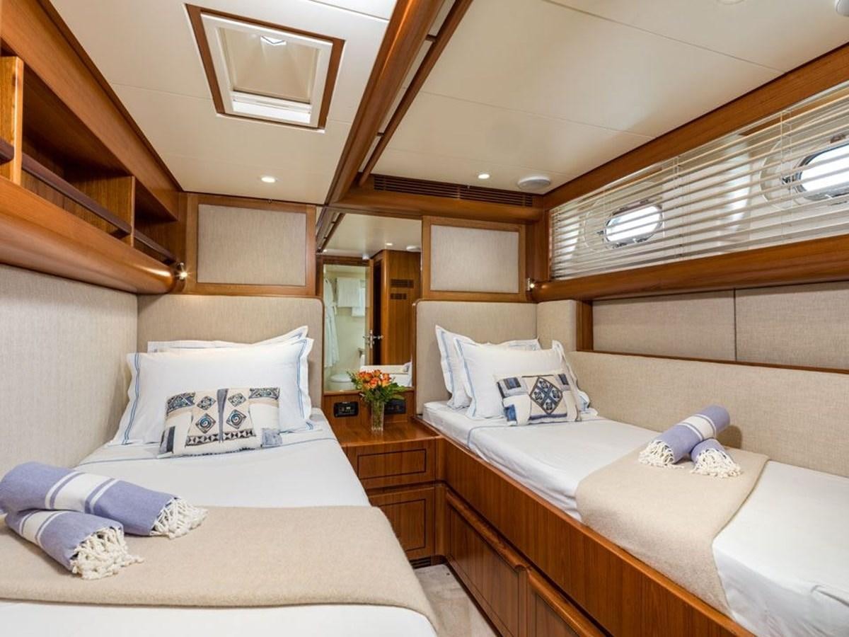 a room with a bed and a couch aboard CHARLATAN Yacht for Sale