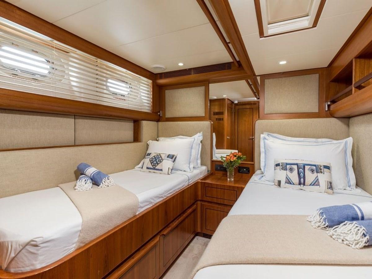 a room with a bed and a couch aboard CHARLATAN Yacht for Sale