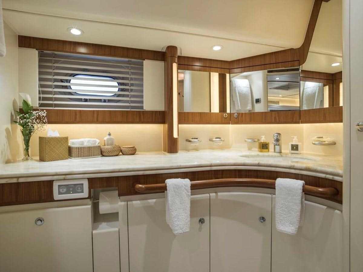 a bathroom with a large mirror aboard CHARLATAN Yacht for Sale