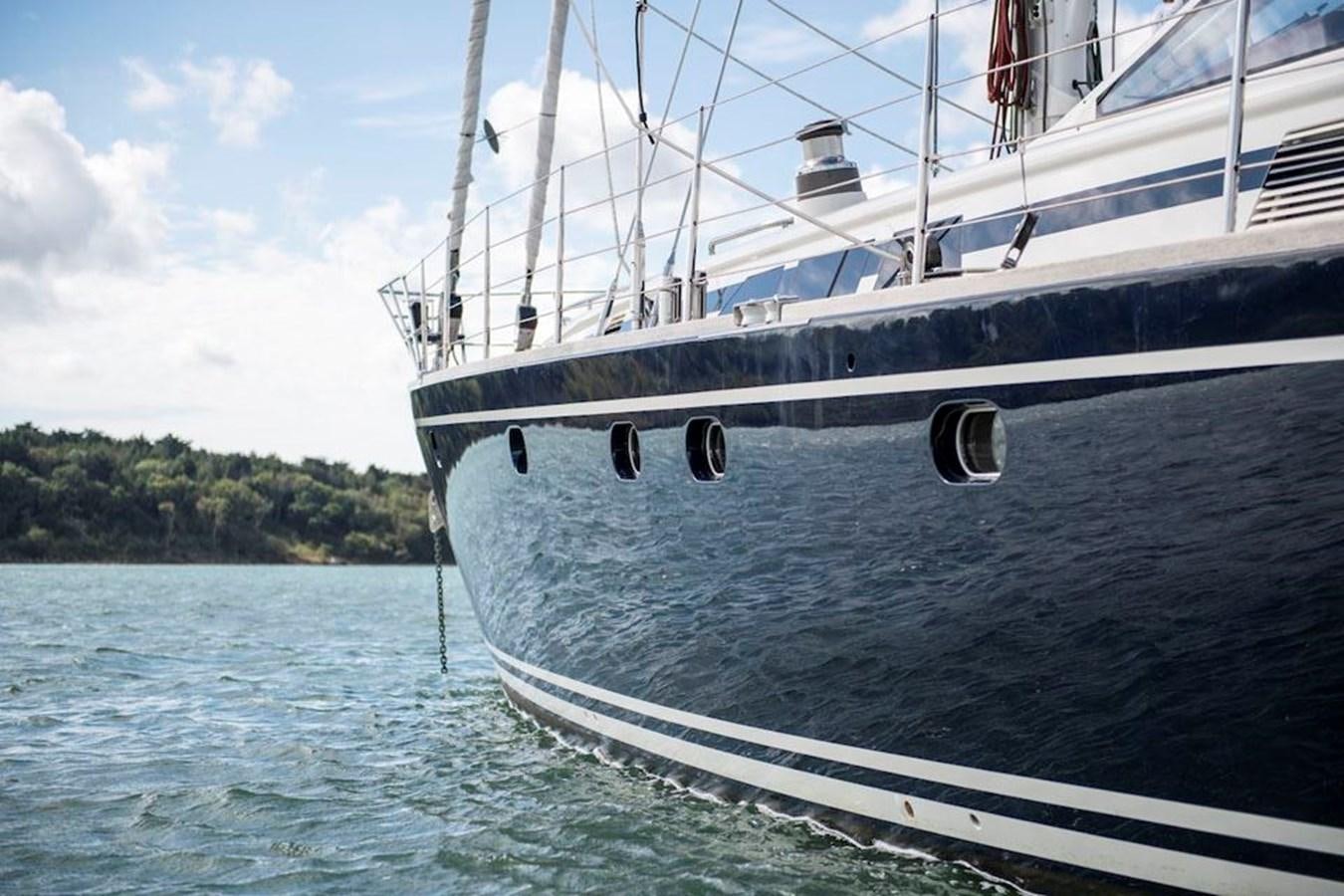 a large white boat in the water aboard CHARLATAN Yacht for Sale