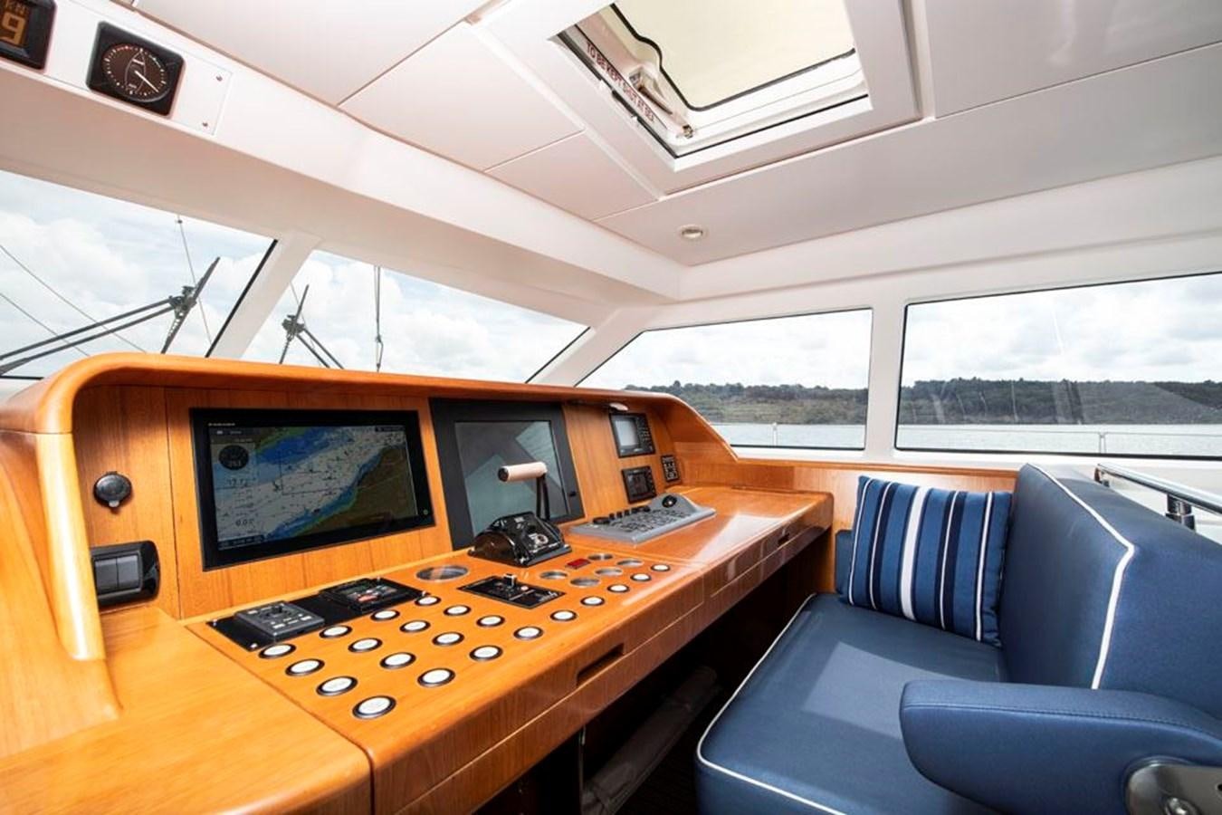 a room with a desk and a computer aboard CHARLATAN Yacht for Sale