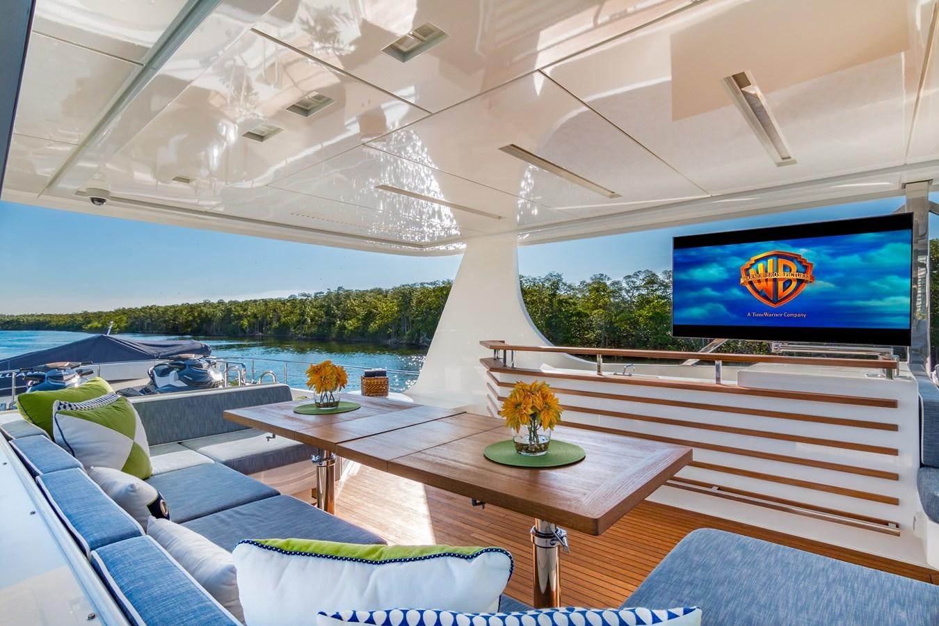 a room with a table and a tv aboard PRIMA MEA Yacht for Sale