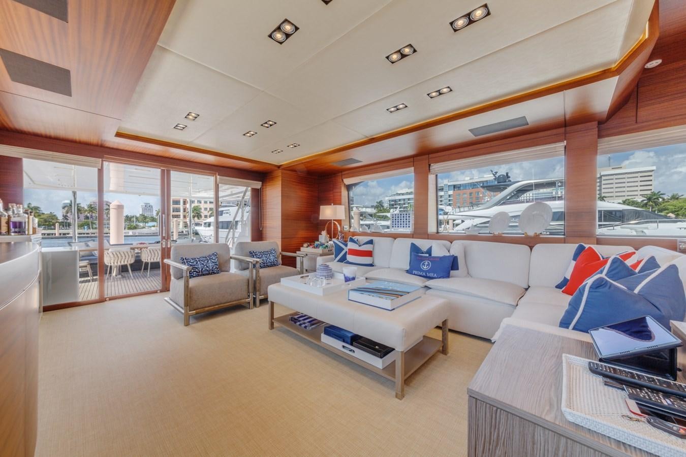 a living room with a large window aboard PRIMA MEA Yacht for Sale