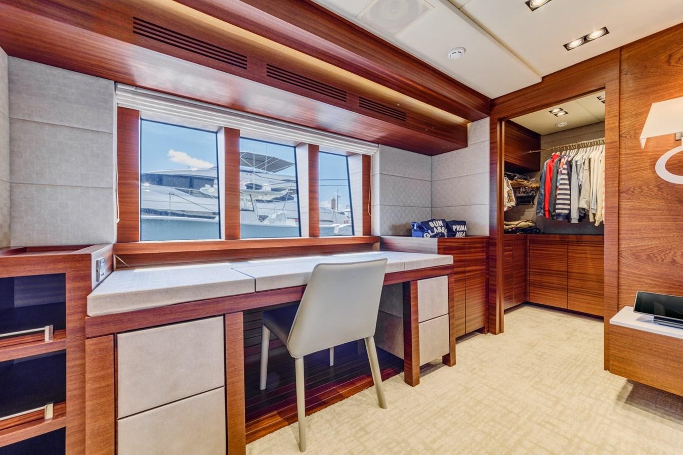 a room with a desk and chairs aboard PRIMA MEA Yacht for Sale