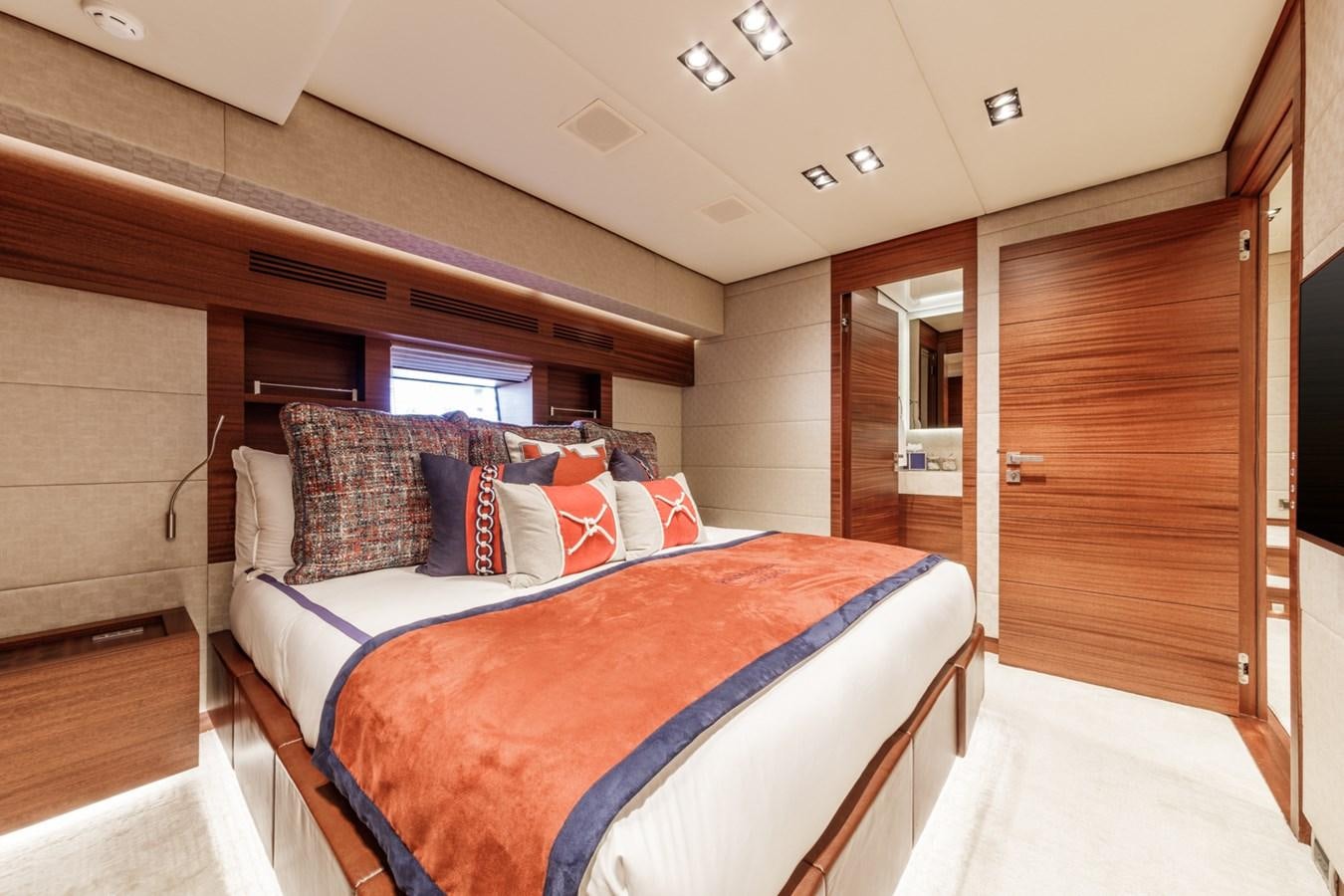 a bed in a room aboard PRIMA MEA Yacht for Sale