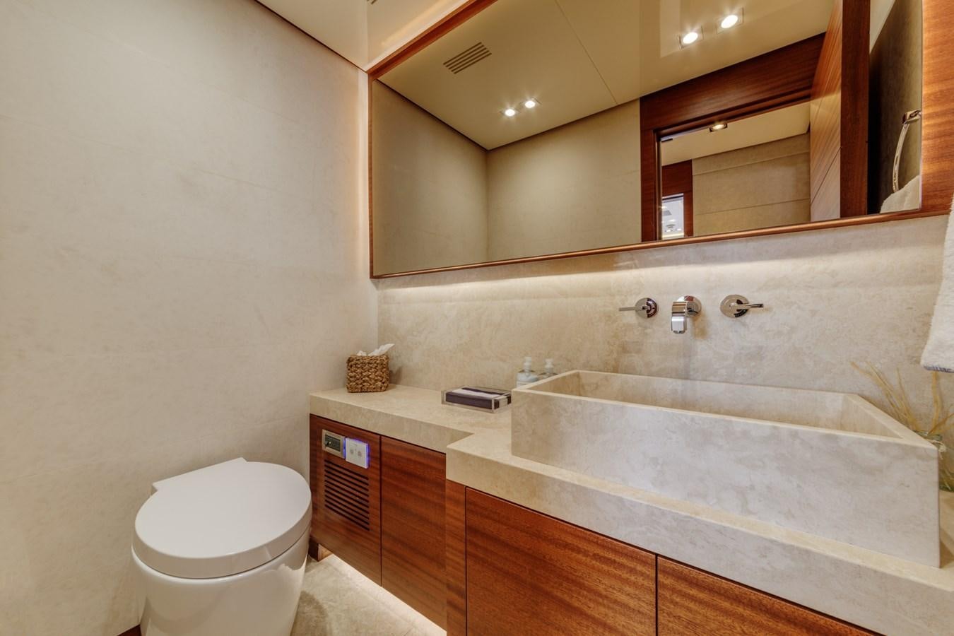 a bathroom with a large mirror aboard PRIMA MEA Yacht for Sale