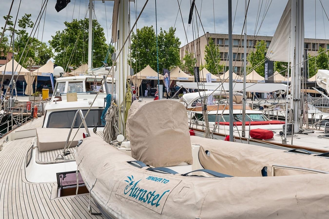 a group of boats are parked in a harbor aboard AURASTEL Yacht for Sale