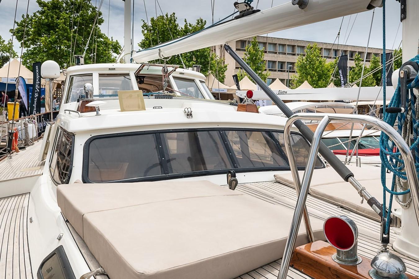 a white car with a large spoiler aboard AURASTEL Yacht for Sale