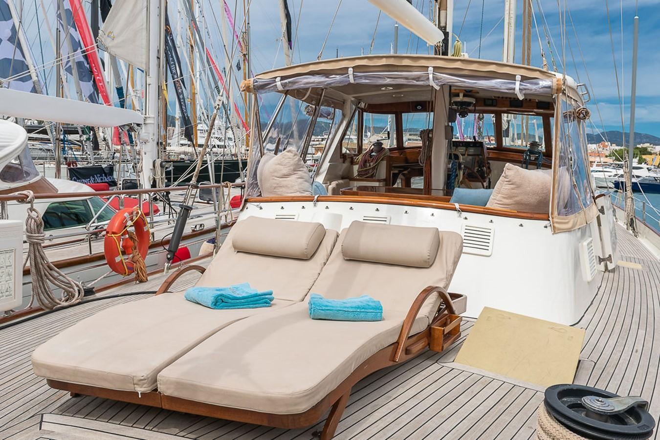 a boat with a white canopy aboard AURASTEL Yacht for Sale