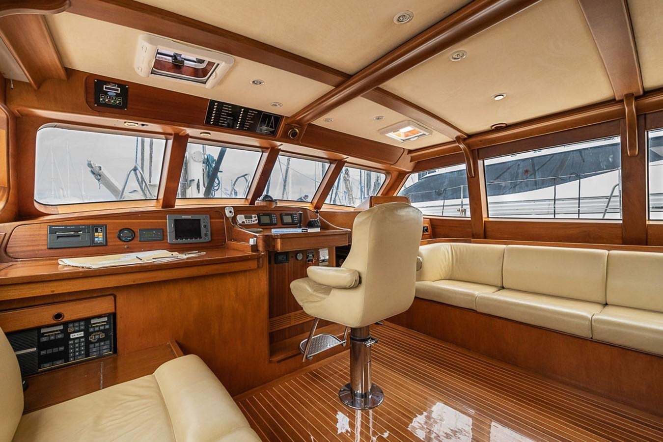 a room with a couch and a chair aboard AURASTEL Yacht for Sale