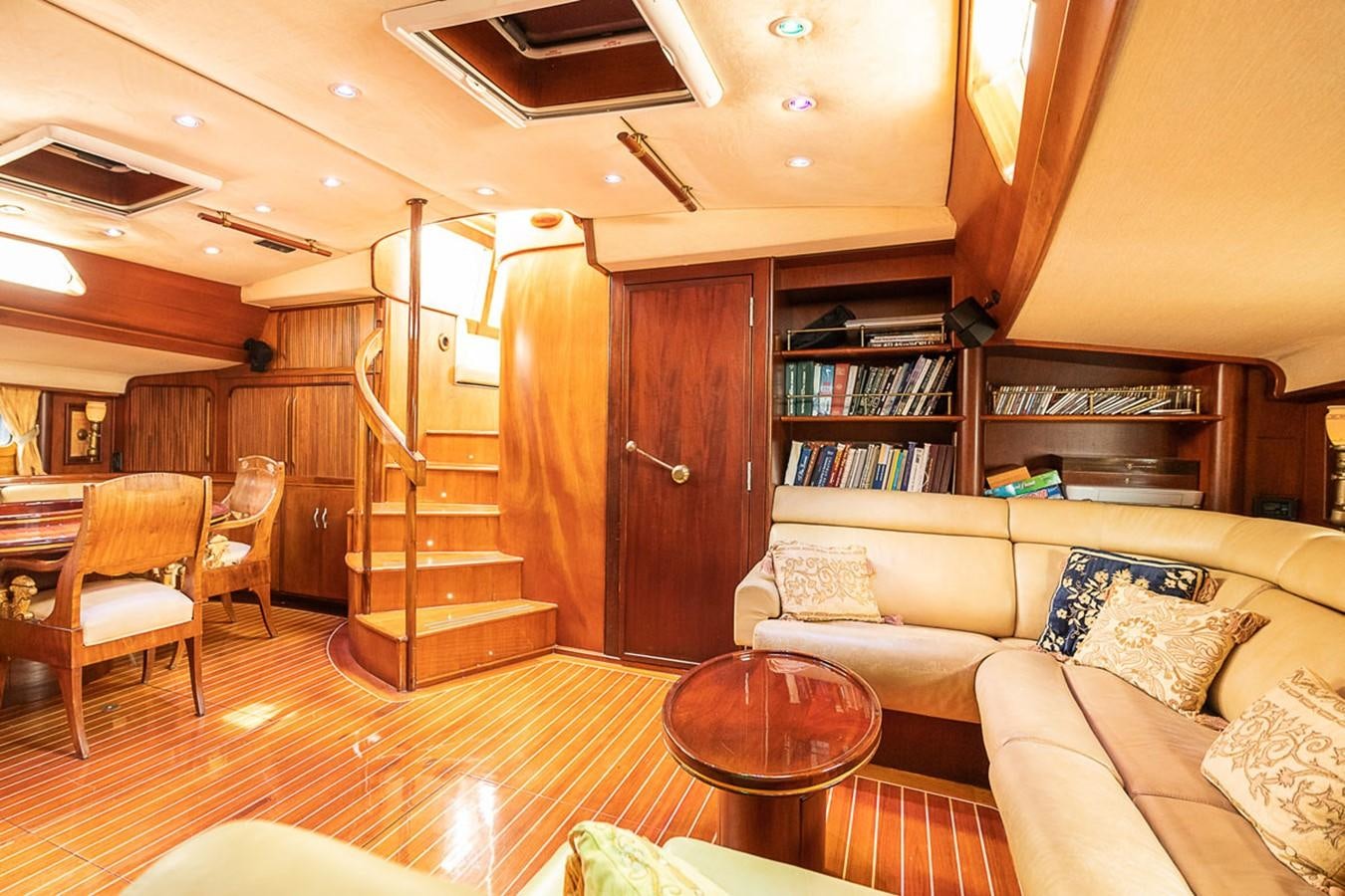 a living room with a staircase aboard AURASTEL Yacht for Sale