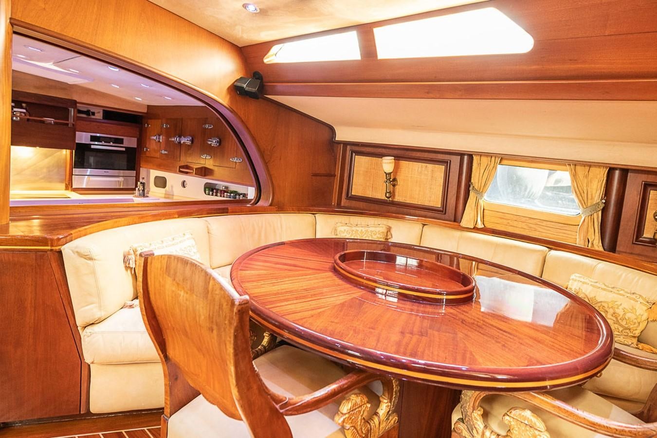 a dining table in a train aboard AURASTEL Yacht for Sale