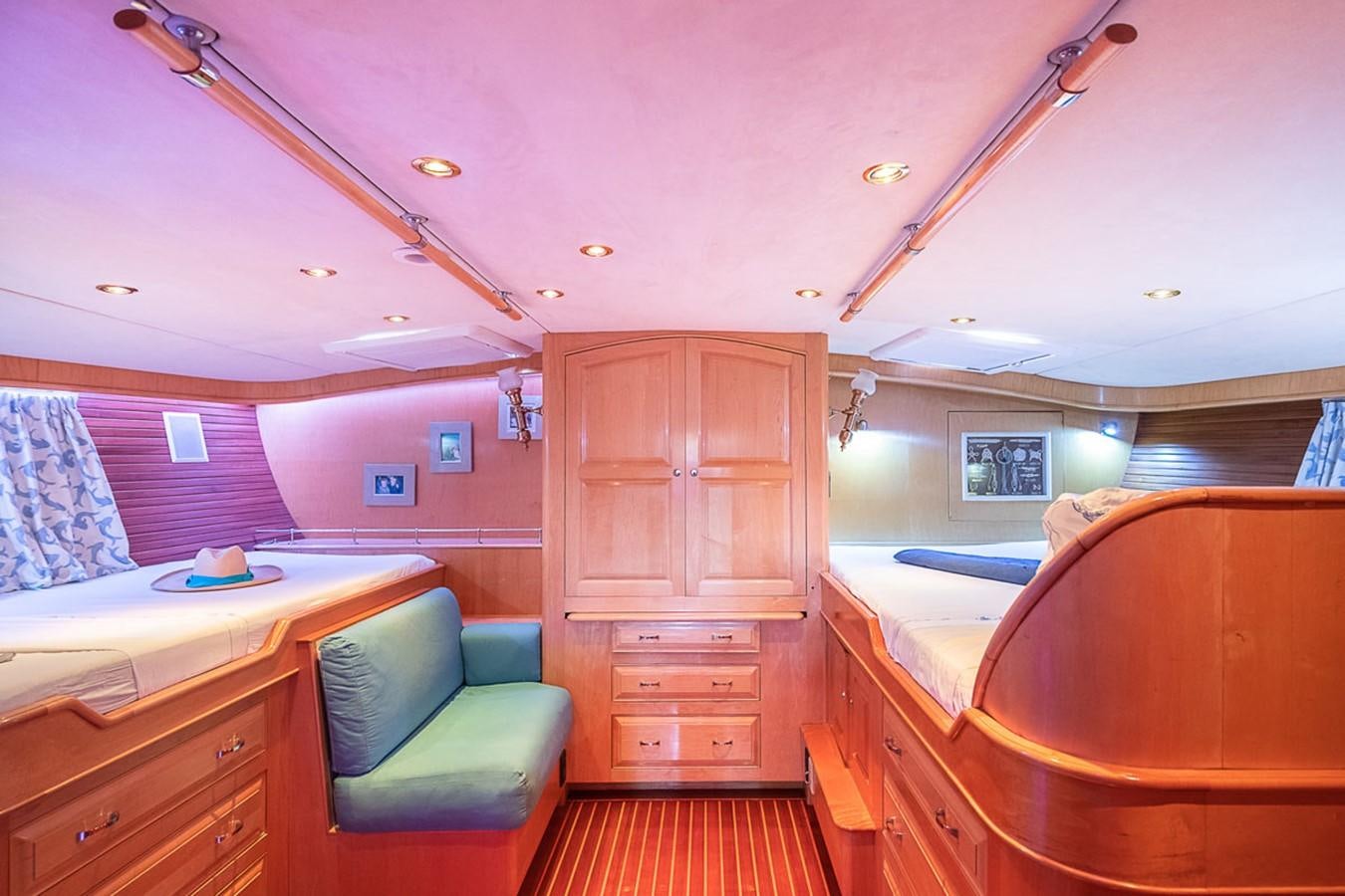a room with a bed and a desk aboard AURASTEL Yacht for Sale
