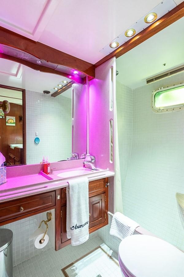 a bathroom with a large mirror aboard AURASTEL Yacht for Sale