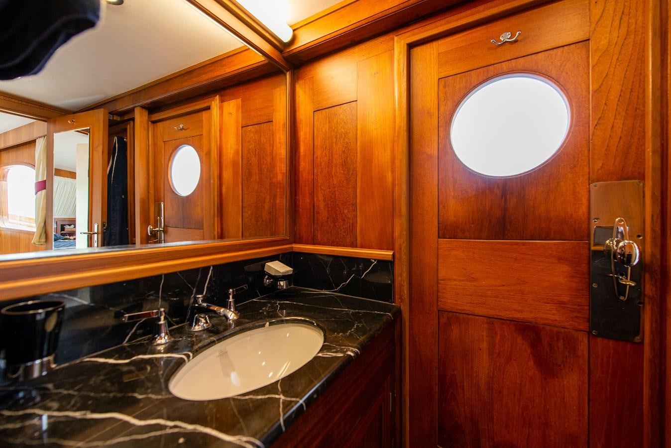 a bathroom with a sink and a mirror aboard SANS SOUCI Yacht for Sale
