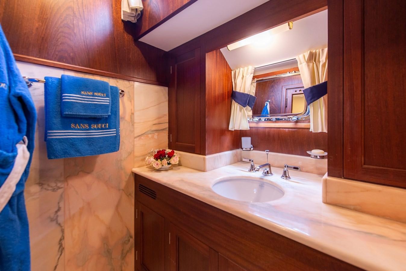 a bathroom with a sink and a mirror aboard SANS SOUCI Yacht for Sale