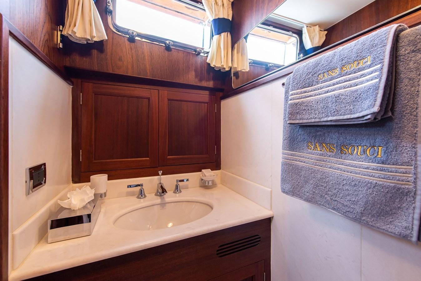 a bathroom with a countertop sink and cabinets aboard SANS SOUCI Yacht for Sale