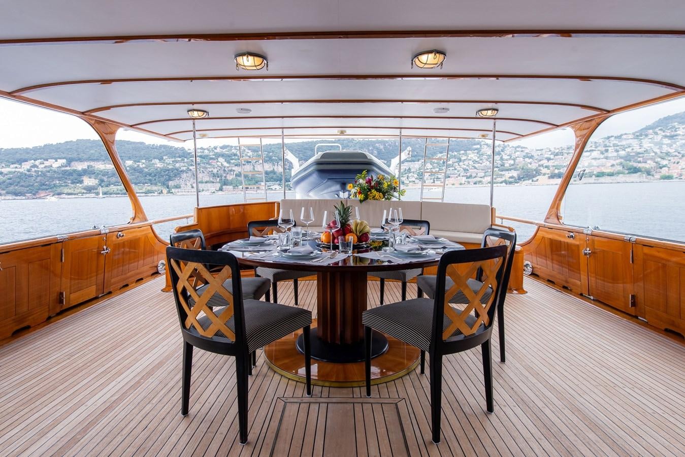 a table and chairs on a deck aboard SANS SOUCI Yacht for Sale