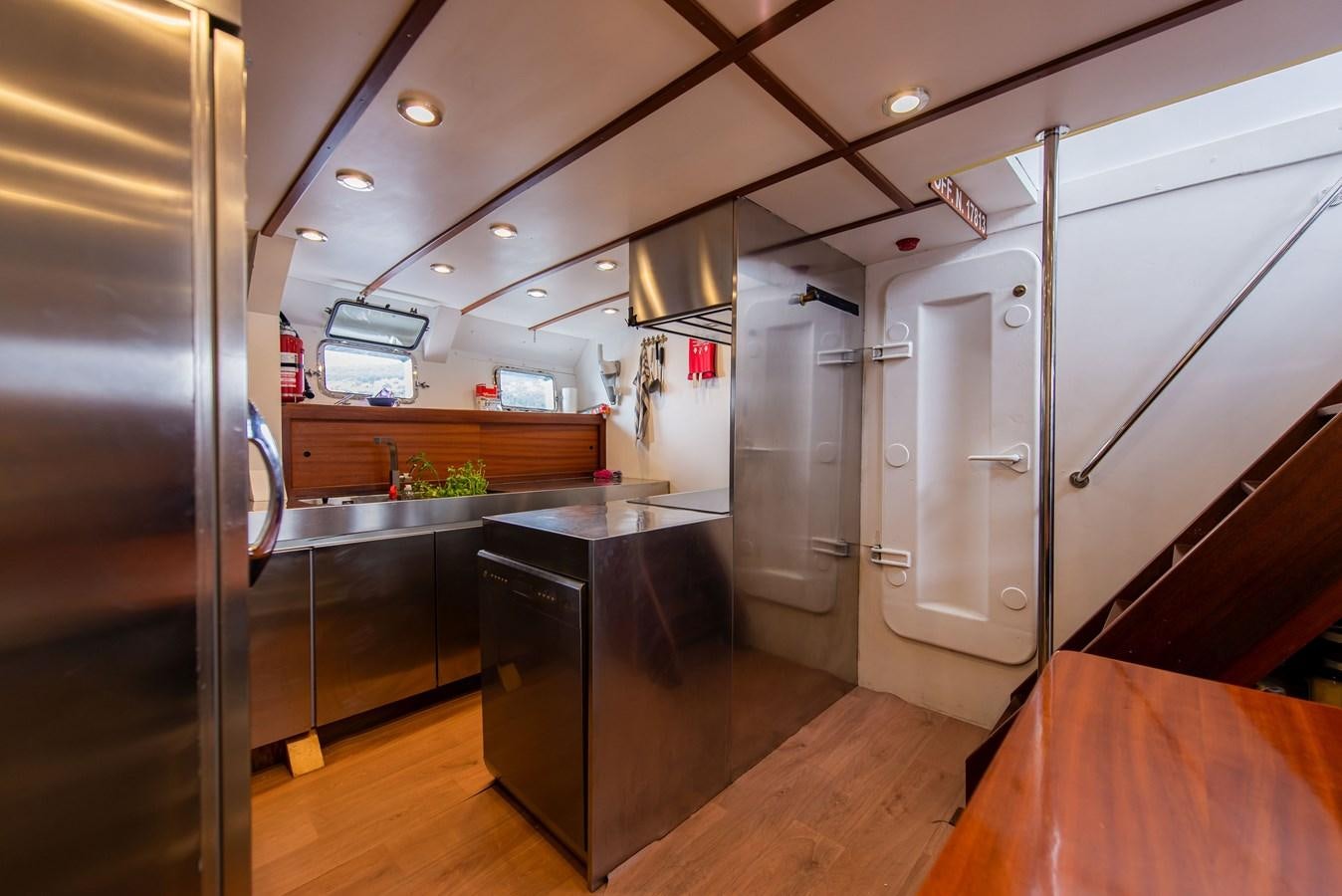 a kitchen with a large island aboard SANS SOUCI Yacht for Sale