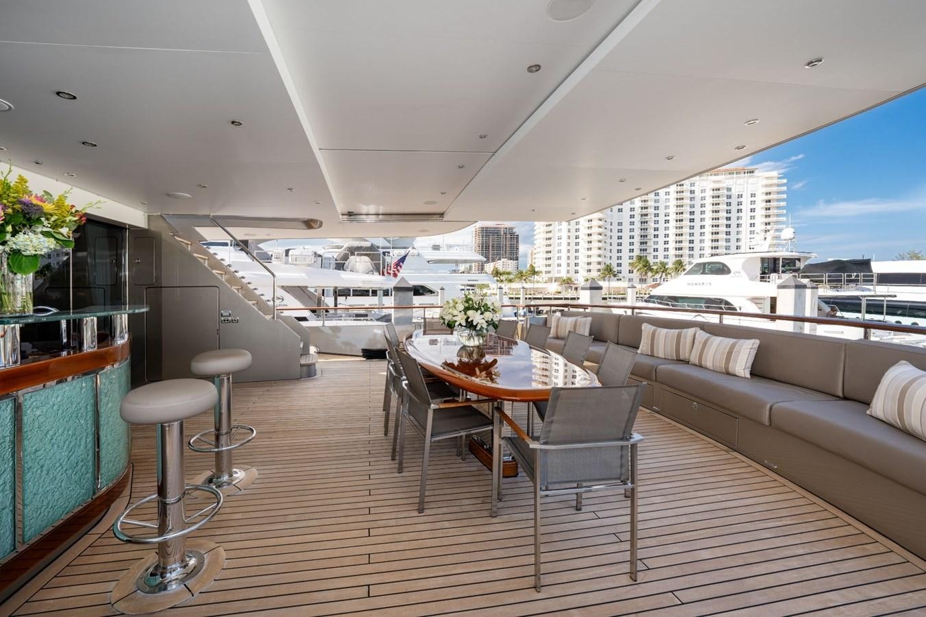 a living room with a couch and a table aboard VESPER Yacht for Sale