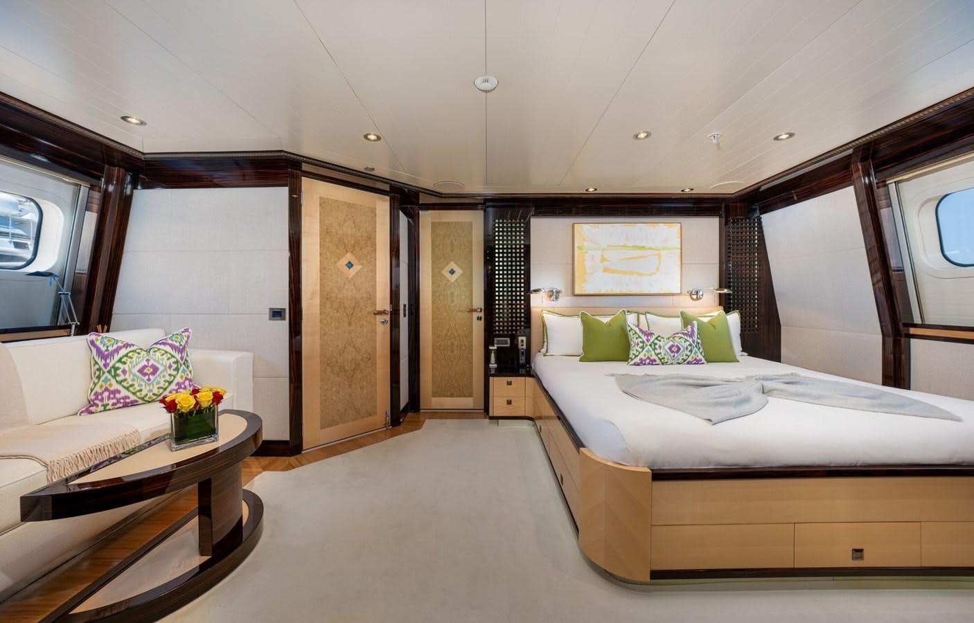 a room with a bed and a couch aboard VESPER Yacht for Sale