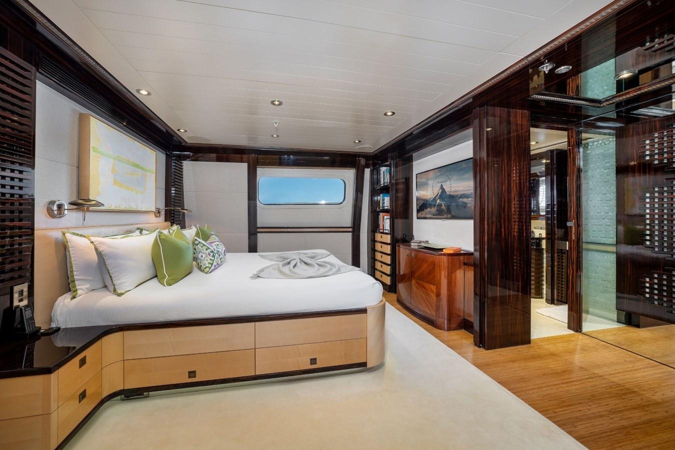 a bedroom with a large bed aboard VESPER Yacht for Sale