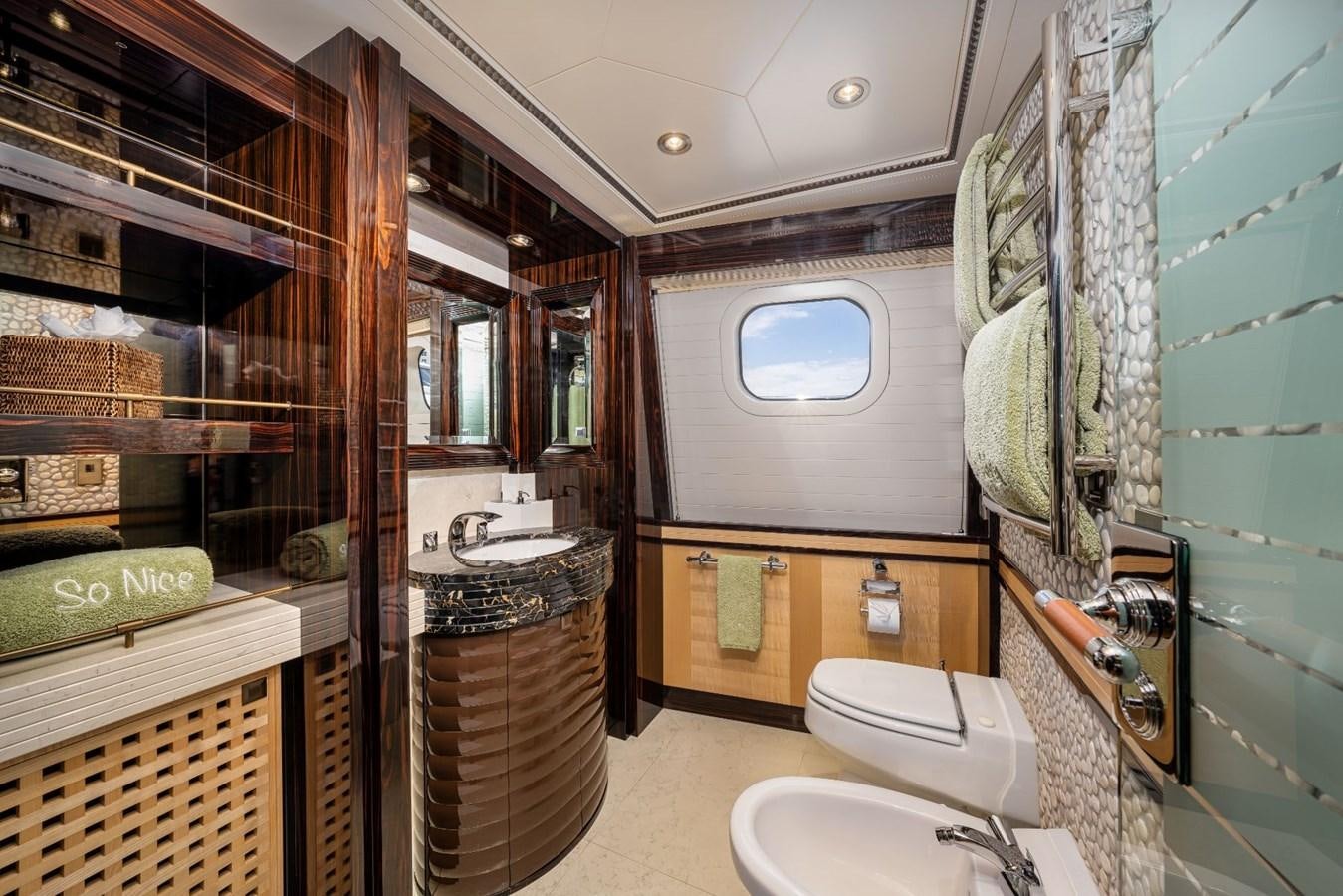 a bathroom with a toilet and sink aboard VESPER Yacht for Sale