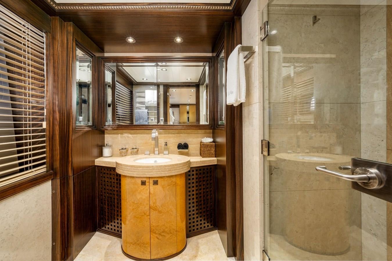 a bathroom with a glass shower aboard VESPER Yacht for Sale