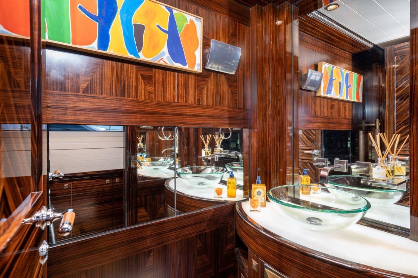 a bathroom with a sink and a mirror aboard VESPER Yacht for Sale
