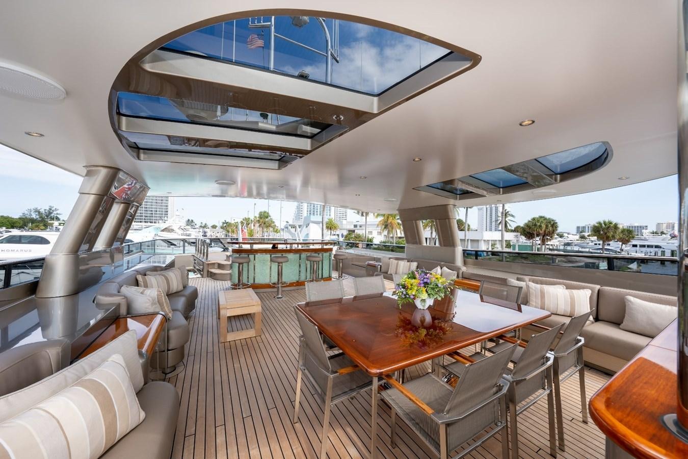 a large living room with a large balcony aboard VESPER Yacht for Sale