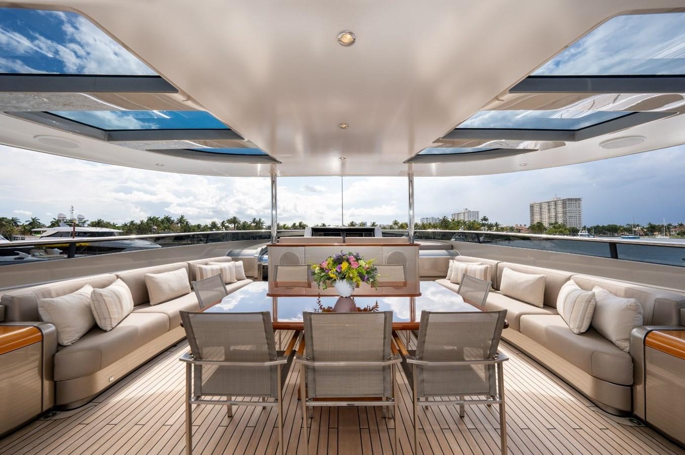 a living room with a large patio aboard VESPER Yacht for Sale