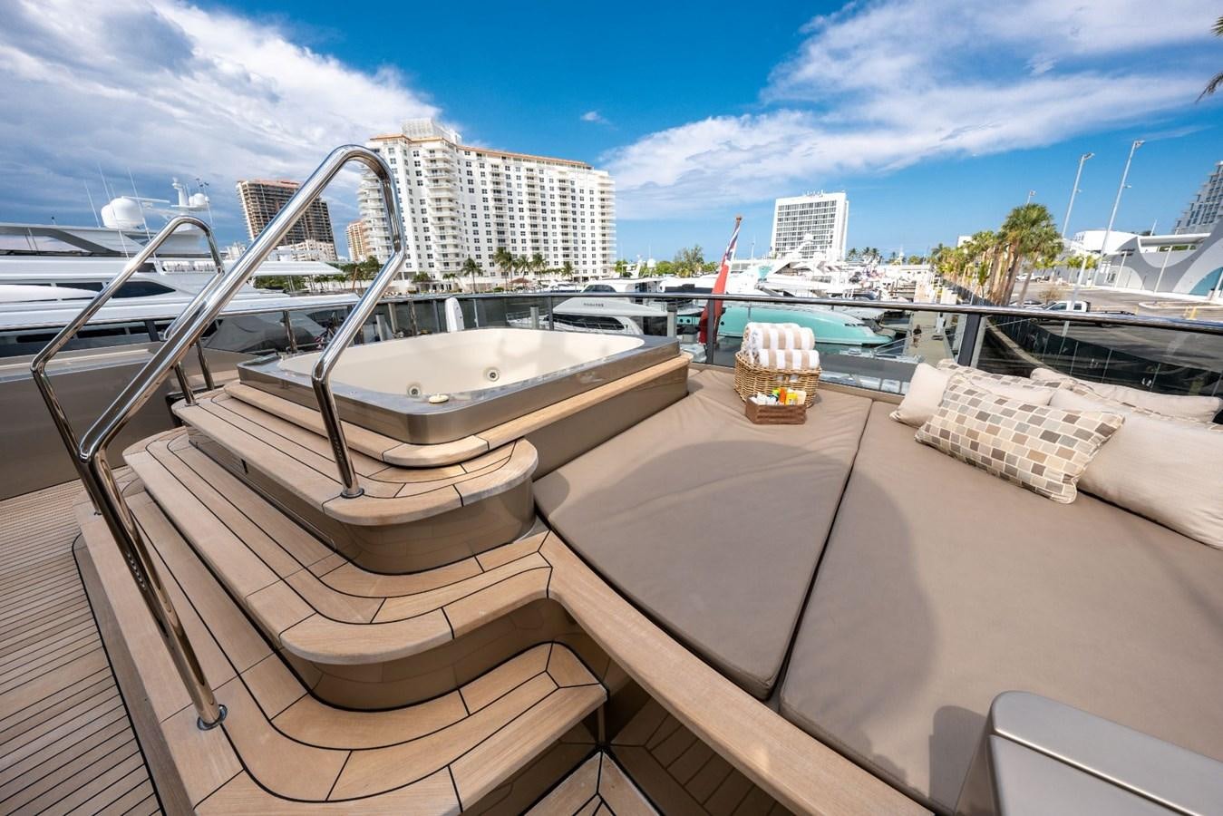 a deck with a view of a city and water aboard VESPER Yacht for Sale