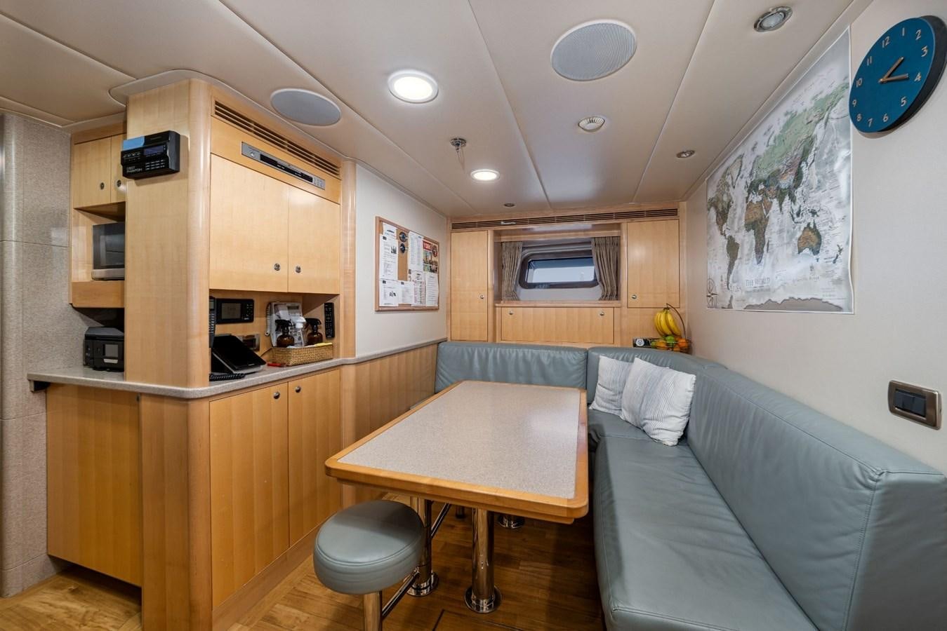 a living room with a couch and a table aboard VESPER Yacht for Sale