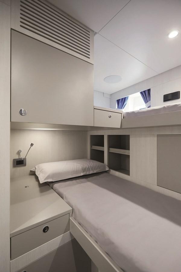 a room with a bed and a window aboard AL GASSAR 2022 Yacht for Sale