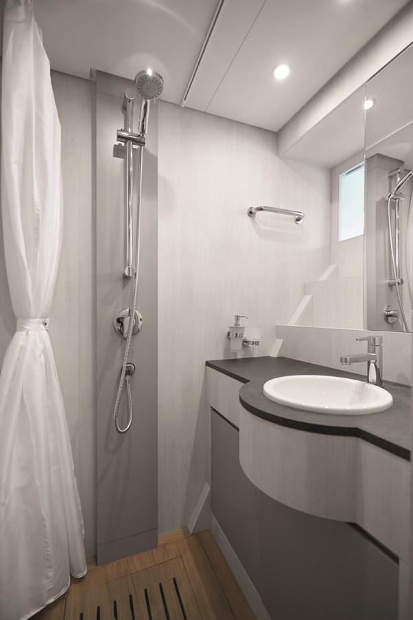 a bathroom with a sink and a shower aboard AL GASSAR 2022 Yacht for Sale