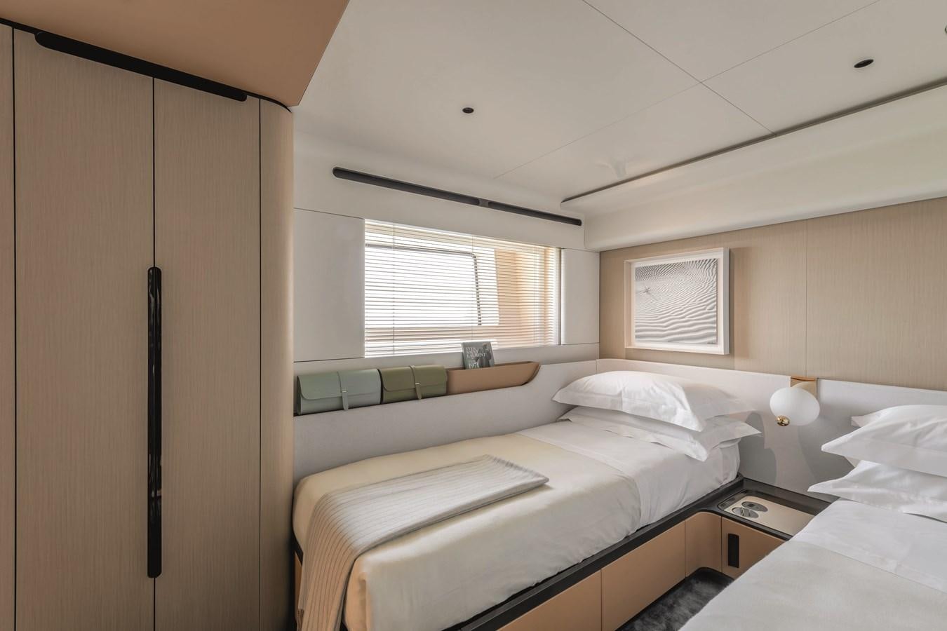 a room with two beds aboard AL GASSAR 2022 Yacht for Sale