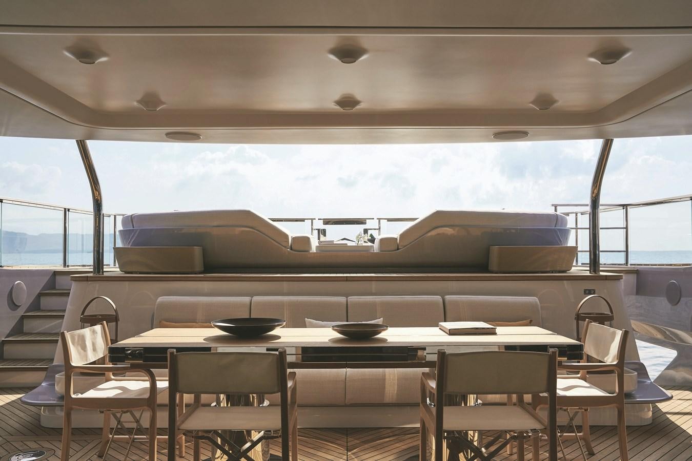 a room with a table and chairs aboard AL GASSAR 2022 Yacht for Sale