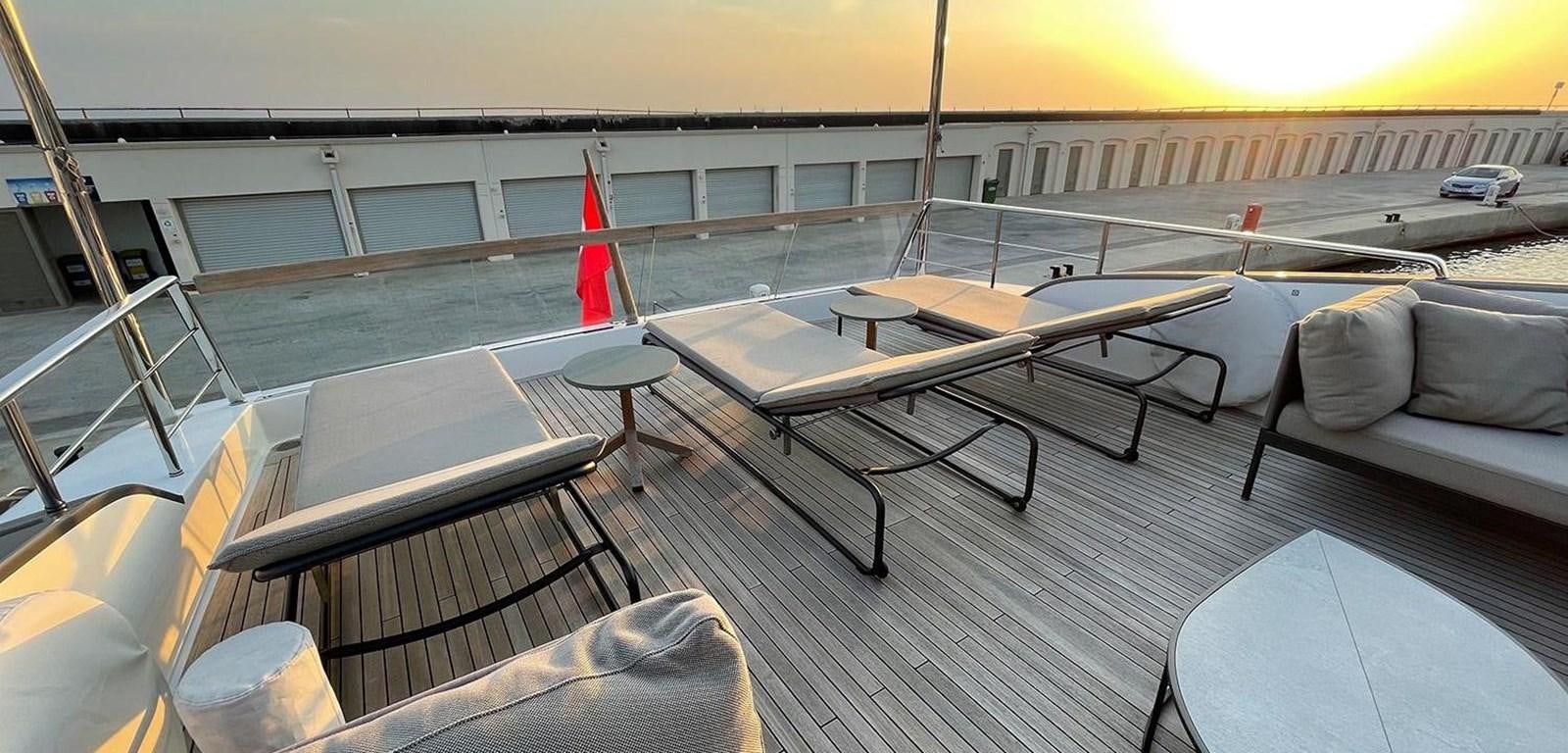 a room with a table and chairs aboard Y2 Yacht for Sale