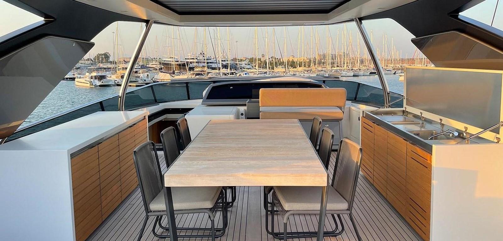 a table and chairs on a boat aboard Y2 Yacht for Sale