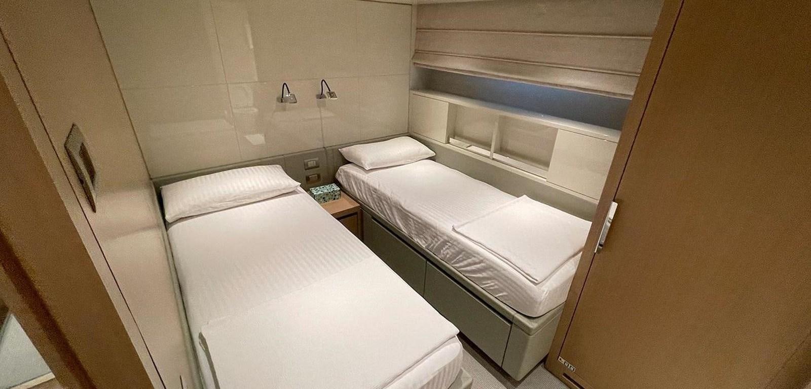 a room with bunk beds aboard Y2 Yacht for Sale