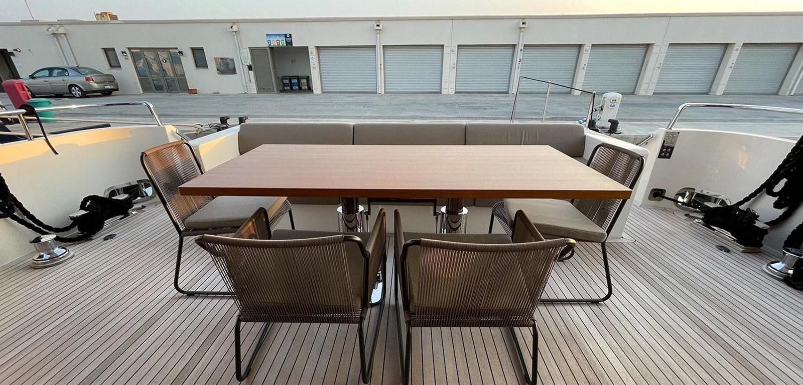 a table and chairs in a room aboard Y2 Yacht for Sale